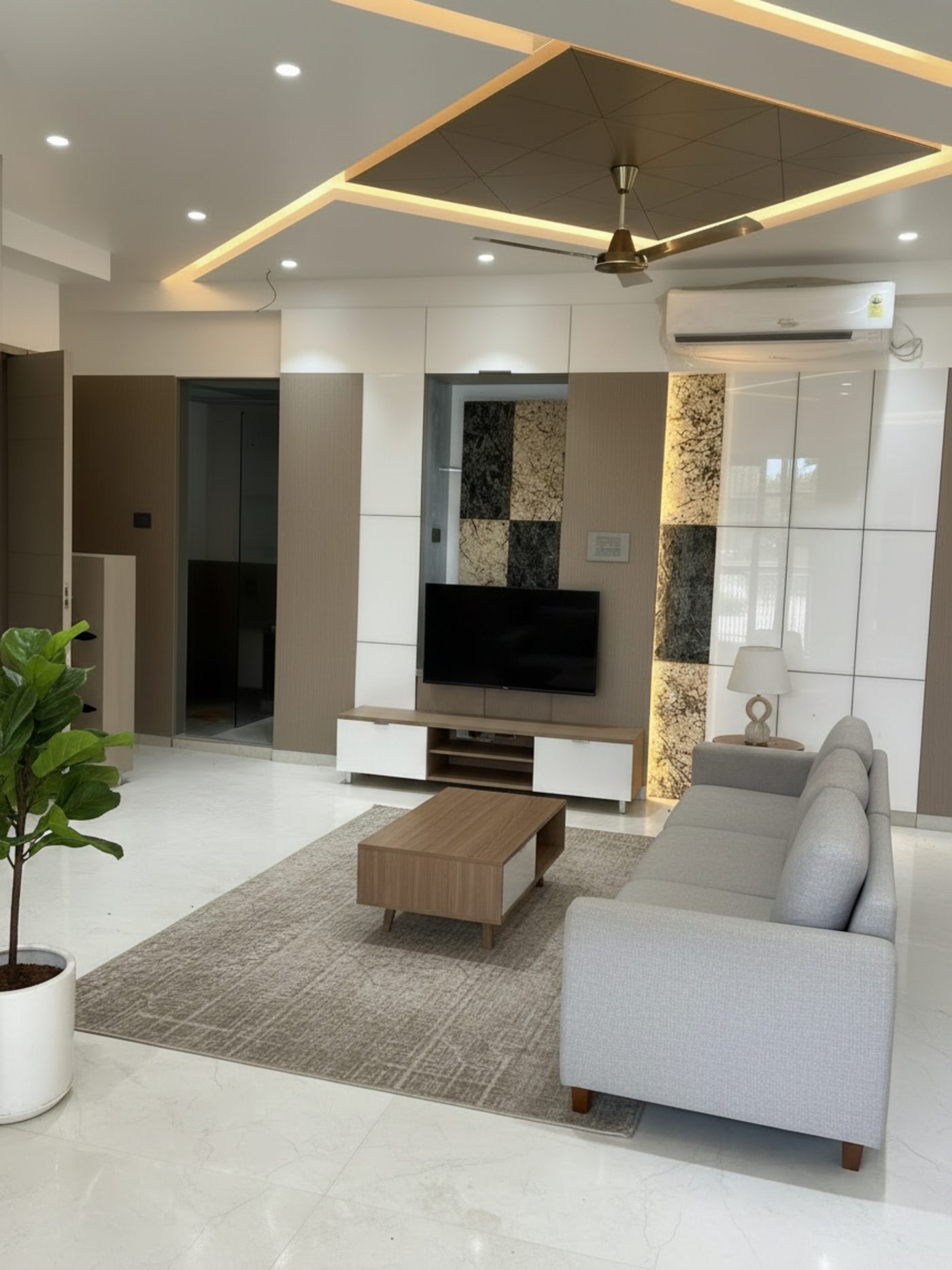 Living area with grey sofa and wooden coffee table