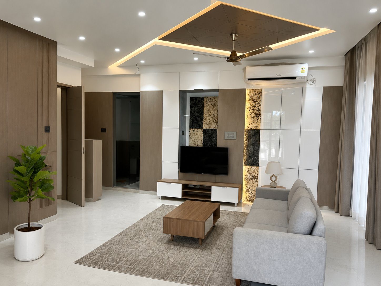 TV wall with white panels and stone inlays